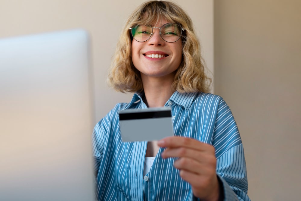 Woman using laptop with coffee